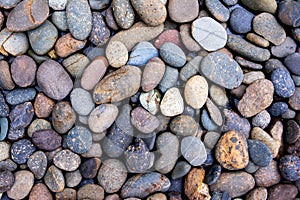 Pebbles background. Gravel background. Colorful pebbles background