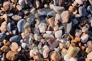 Pebbles on the beach. Can be used as a pattern in graphic work.