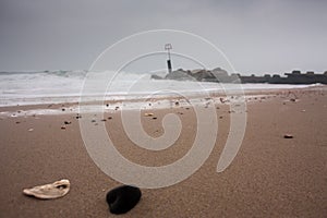 Pebbles on cloudy and windy beach