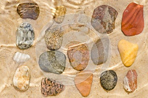 Pebbles composition on stone