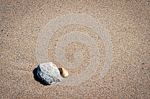 Pebbles on Cornish sand background