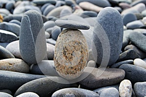 Pebbles of different colors on a rocky beach.