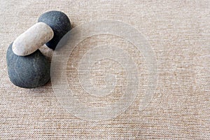 Pebbles and linen, zen textures background