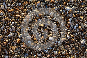 Pebbles mixed with sand of the beautiful Skala beach, Kefalonia island, Ionian sea, Greece