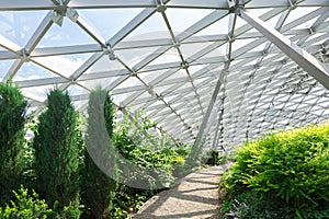 pebbles path under dome with glass roof.