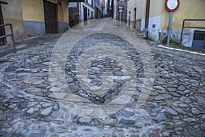 Pebbles pavement decorated with Star of David, Hervas, Spain photo