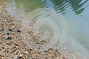 Pebbles on the riverbank in Thailand