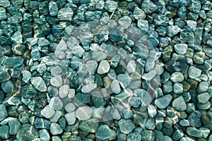 Pebbles and rocks under water background