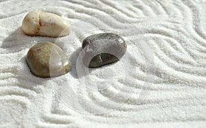 Pebbles in the sand, a background of appeasement