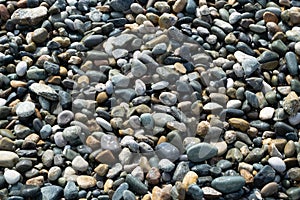 Pebbles on the seashore. Stone background. Nature. Rest on the sea.