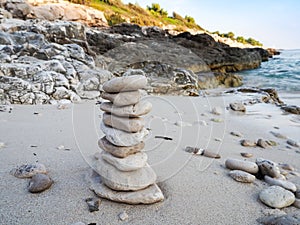 Pebbles tower on a sandy beach
