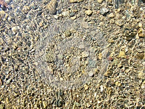 Pebbles in the water of the canyon Goynuk in Turkey