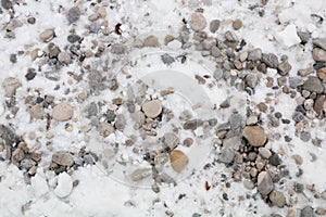 Pebblestone background with fresh fallen snow