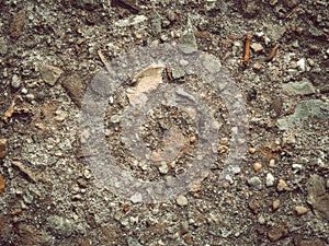 Pebblestones at the dirt road background