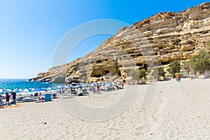 Pebbly beach Matala, Greece Crete. Matala has become famous for artificial Neolithic caves, carved in limestone rocks.