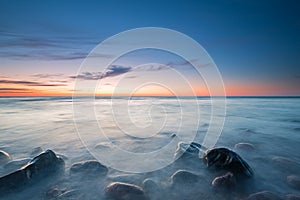 The pebbly beach in Poland at sunset