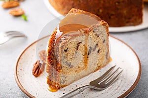 Pecan caramel pound cake baked in a bundt pan slice on a plate