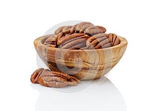 Pecan nuts in wood bowl