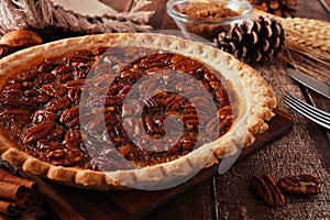 Pecan pie, close up table scene with a wood background