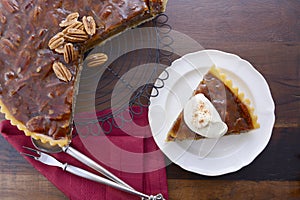 Pecan pie on dark wood background.