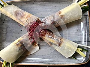 Pecking duck served with cucumber in thin pancake with sweet sauce