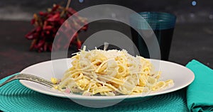 Pecorino cheese on spaghetti alla carbonara