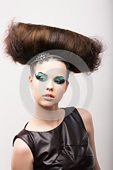 Peculiar Emotional Girl with Odd Creative Styling. Fantastic Hairdo. High Fashion