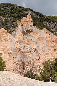 Peculiar red rocks with pinnacles and towers called Lame Rosse in the Sibillini mountains Marche, Italy