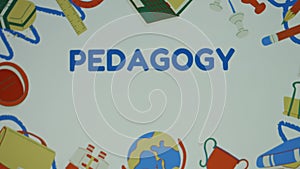 Pedagogy inscription on background with school supplies. Education concept. Blurred