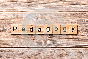 Pedagogy word written on wood block. Pedagogy text on wooden table for your desing, concept