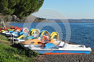 Pedal boats on the beach of Trevignano Romano in Italy