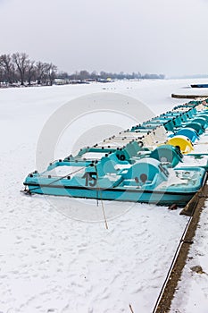 Pedal boats on a frozen lake