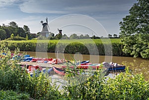 Pedal Boats and Twin Windmills in Greetsiel, North Sea, East Frisia, Germany