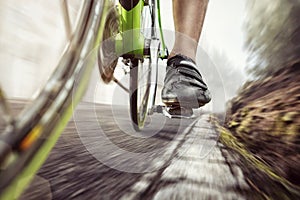 Pedal of a fast moving racing bicycle