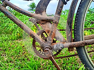 Rusty old bicycle frame and chain