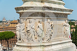 Pedestal Detail of Victor Emmanuel II statue in Rome. St PeterÃ¢â¬â¢s Basilica at the left photo