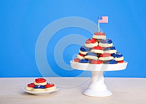 Pedestal with patriotic cookies next to small plate of cookies