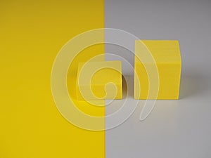 Pedestal squares shadows on a yellow and gray background