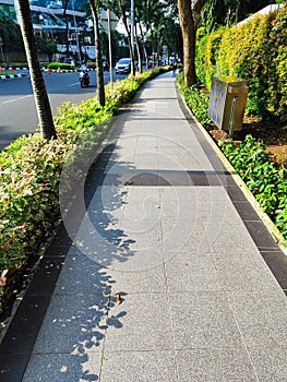 Pedestrian area for pedestrians, with plants and greenery providing fresh air.