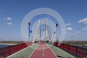 Pedestrian and bicycle paths on the bridge from the right bank of the river to the left.