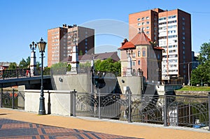 Pedestrian bridge and buildings on the banks of the river Pregel. Kaliningrad, Russia