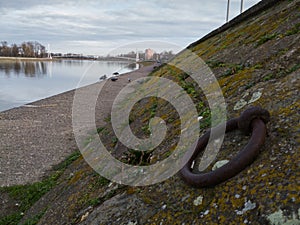 Pedestrian bridge on the Drava in Osijek. Landscaped shore with alcove for mooring boats