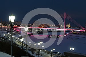 Pedestrian bridge on the embankment in Tyumen, Russia, at night, in winter