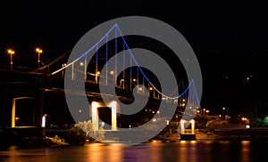 Pedestrian bridge illuminated in the night