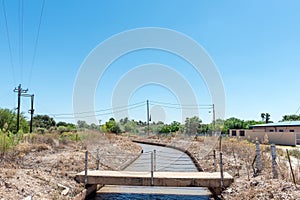 Pedestrian bridge over a canal in Groblershoop