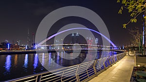 Pedestrian Bridge over the Dubai Water Canal day to night timelapse, United Arab Emirates