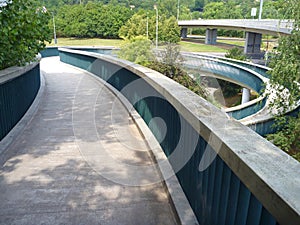 Pedestrian bridge with a round spiral acces