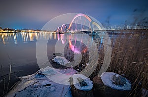 Pedestrian bridge in winter night scenery