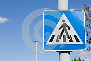 Pedestrian crossing blue road sign
