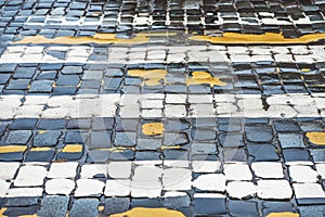 Pedestrian crossing with cobblestone road, nobody.Old stone texture close up. Abstract background